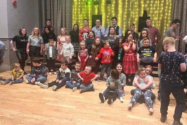 Members of Causeway Downs Syndrome Support Group enjoying their Christmas party. The group is using a £20,000 grant from The National Lottery Community Fund to deliver speech and language workshops for children and young people with Downs Syndrome to improve skills and bring people together.