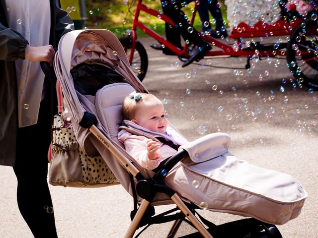A young visitor loving the bubbles.