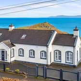 On the market for offers over £425,000 with PJ McIlroy & Son, this four bedroom, three bathroom property can be found on the scenic route between Ballycastle and Cushendun.  Enjoying stunning views over the rugged green coastline around Torr Head to the sea and Scottish coast on the Mull of Kintyre, it has been extensively modernised and benefits from a naturally bright and spacious blend of accommodation.