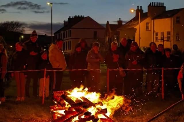Supporters at Castle Green for Carrickfergus Senior Gateway Club's firewalk in memory of former club president, Trevor Monteith. Photo: Carrickfergus Senior Gateway Club