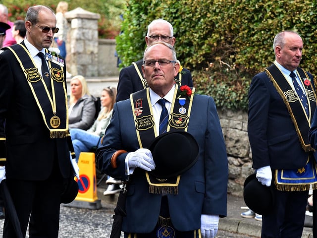 RBP officers pause at the War Memorial during the RBP Last Saturday parade in Loughgall. TH36.