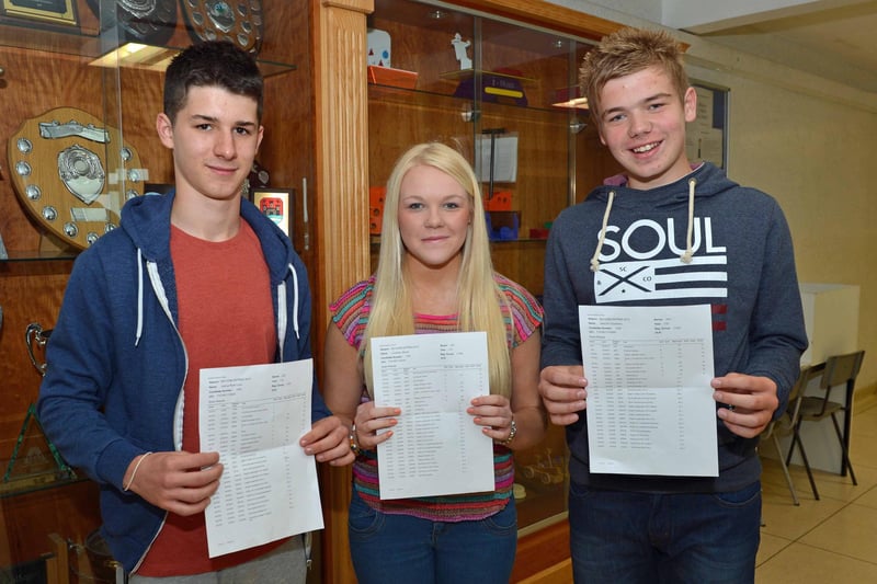 Carrickfergus College students Jack Chalmers, Courtney Brown and Joshua Lown with their GCSE results in 2013. INCT 35-006-PSB