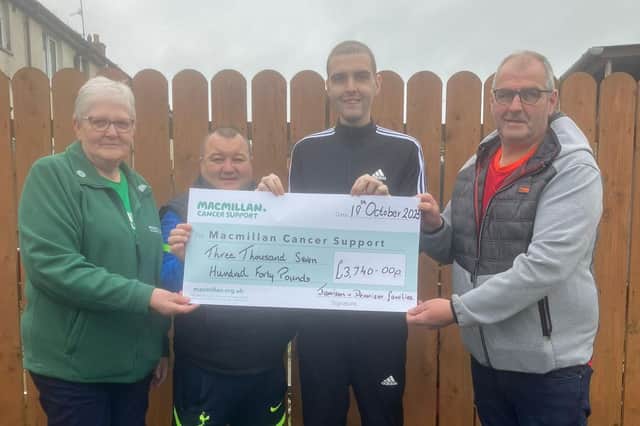 Presenting the cheque to Macmillan Cancer Support.