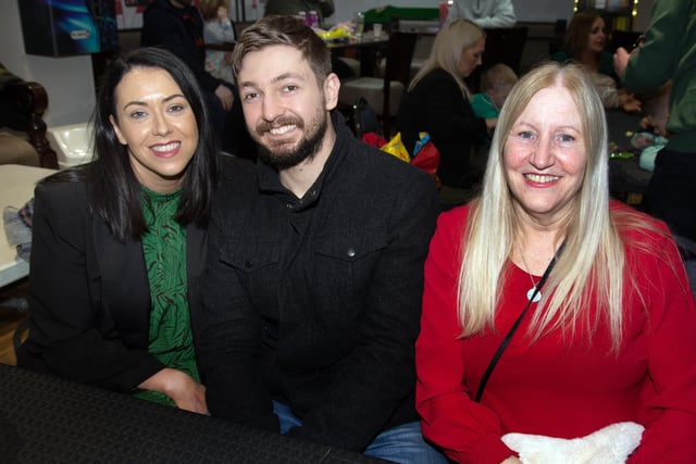 All smiles at the Tír Na nÓg GFC St Patrick's Day Party are from left, Elaine O'Neill, Paddy Mulholland and Colette O'Neill. PT12-224.