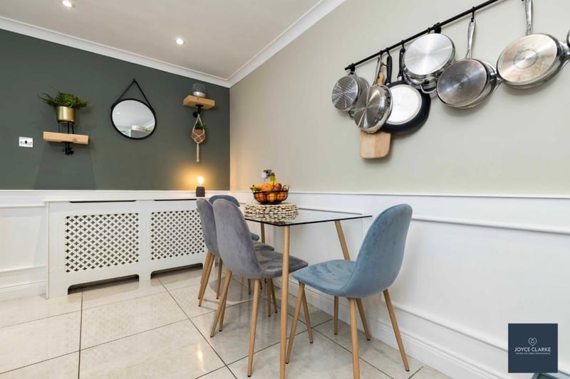 There is attractive wall panelling to the dining area of the kitchen with ceiling cornicing.