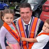 Local Orangeman, Andrew Scott pitured with his children, Eden (5) and Joe (3) before the mini 12th parade in Markethill on Saturday evening. PT27-257.