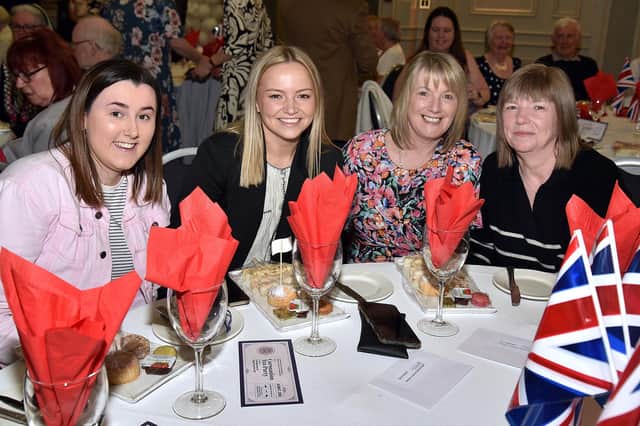 Enjoying the Coronation Tea Party in the Seagoe Hotel are, from left, Ella Cunningham, Kirsty Rea, Pamela Cunningham and Sandra Rea. PT17-283.