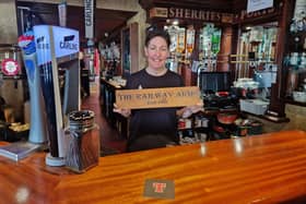 Clare Johnston behind the bar of Coleraine's Railway Arms which celebrates 50 years in the Johnston family this June.