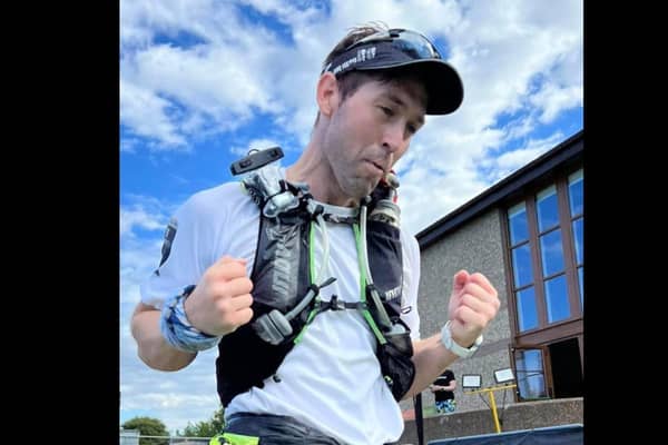 Thomas crosses the finish line during the Race Across Scotland ultra-marathon.  The Magheramorne man was competing in the event to raise funds for The Big C Foundation.  Photo: Race Across Scotland - GB Ultra team