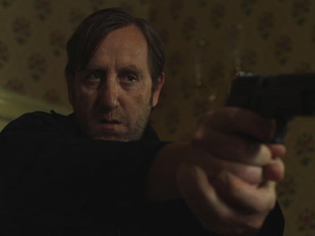 Known for its intense and unsettling narrative, Michael Smiley’s role as Gal in this psychological horror-thriller film adds a layer of mystery to the series of contract killings taken on.
As Michael’s character becomes more integral to the unsettling events unfolding, his performance stands out for its intricate nature and the pervasive sense of disquiet it imparts. Wrapped in an air of uncertainty, Michael enriches the narrative as it takes unanticipated and spine-chilling twists, consistently holding the audience’s attention, and leaving them in dread and suspense throughout the film.