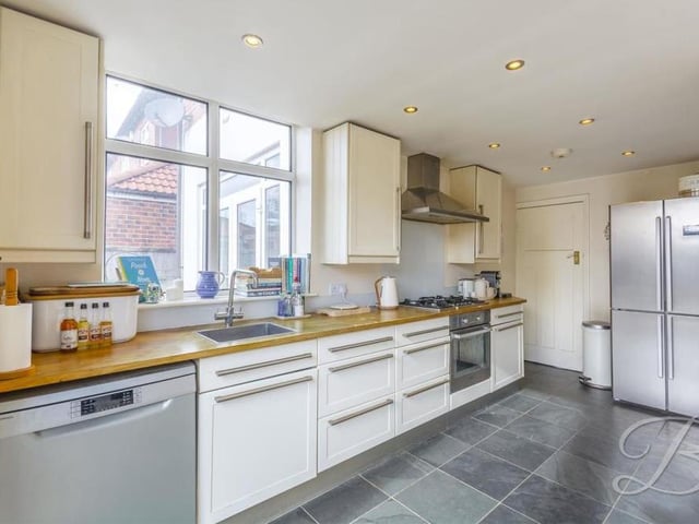 At the back of the ground floor is this impressive kitchen/diner, which comes complete with a comprehensive range of matching units and cabinets, plus a complementary work surface over and an inset sink. There is an integrated oven, as well as space and plumbing for a dishwasher and fridge freezer.