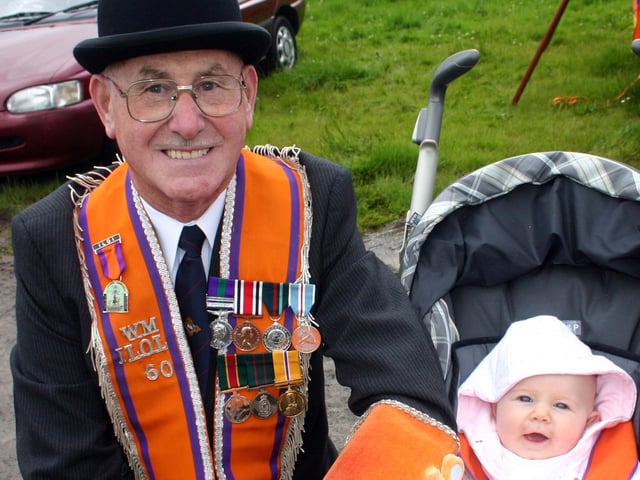 Worshipful Master of John Calvin Memorial ILOL No.60 James Doyle pictured along with litlle Zara Ball at this years 12th parade in Ballymoney in 2007.