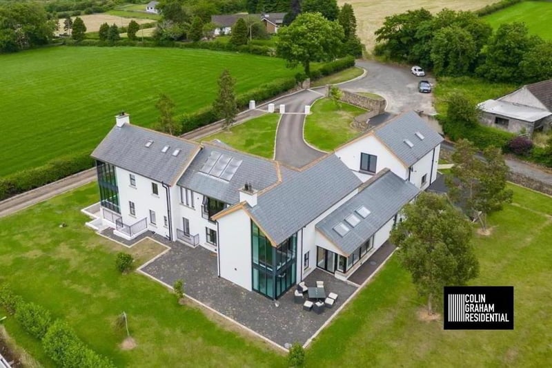 Externally, the property enjoys a generous sized private driveway finished in tarmac; gardens to the front, side and rear finished mainly in lawn; a patio area and timber barbeque area, and a double car port.