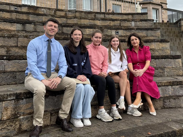 Selection of students who achieved 7 A star to A grades with Mr McCorley, head of Year 12 and Mrs O'Neill, principal.