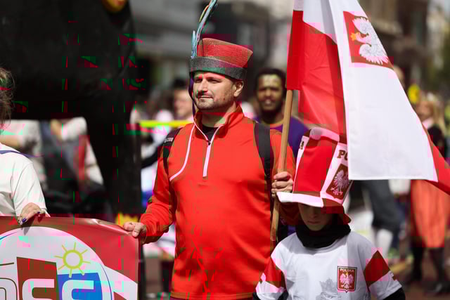 Taking part in the colourful Mela Carnival parade.