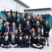 Education Minister Paul Givan with Philip Reid, Principal of Mill Strand IPS, Louise Rossington, Chair of Board of Governors and pupils.
