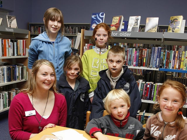 Julie Moore pictured with children who took part in the Halloween Stories and Crafts day in 2008 at Portrush Library.
