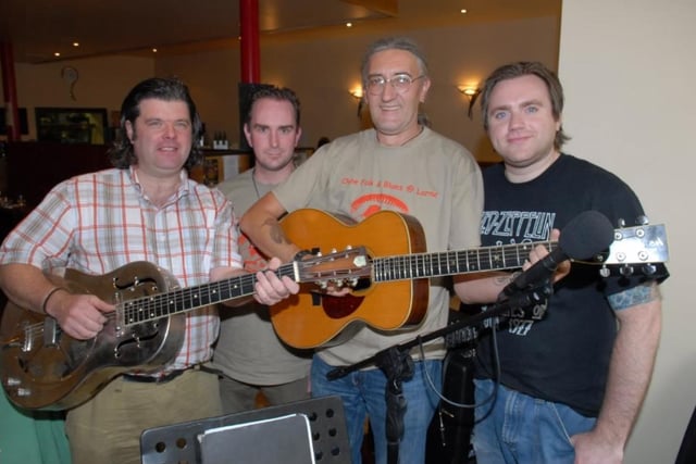 Ross Alexander and Mark Braidner pictured before their set in Caffe Spice at the start of the 2007 Chaine Folk and Blues Festival with event organisers Gary Andrews and Murray McDowell.