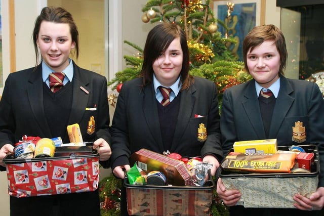 Pictured with hampers for the local community in 2009 are Downshire School pupils Hannah Becket, Sophie Bell Gibney and Shannon McIntosh. Ct52-026tc