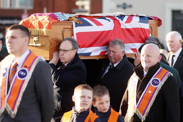 Lord Dodds and Sammy Wilson MP carry their late colleague's coffin. Picture by Jonathan Porter/PressEye