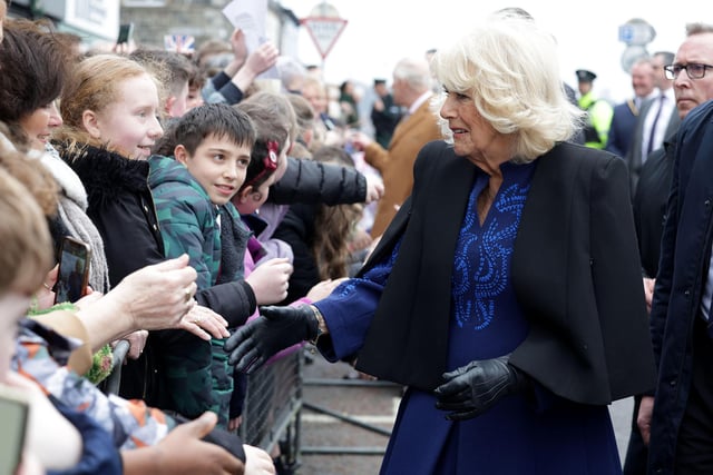 Queen Camilla meets some of the many people who came out to meet the royal couple in Banbridge.