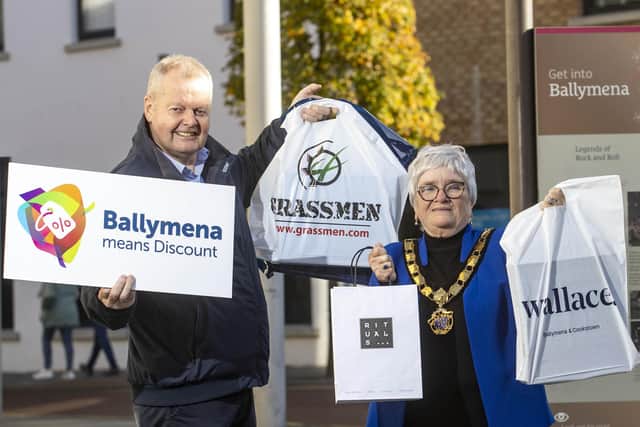 Encouraging shoppers to go to Ballymena on Discount Day are Stephen Reynolds and Deputy Mayor Beth Adger.