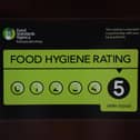 A Food Standards Agency rating sticker on a window of a restaurant in central London. A huge variation in food hygiene standards remains across the UK, with one in five high or medium-risk food outlets failing to meet standards, according to a study.