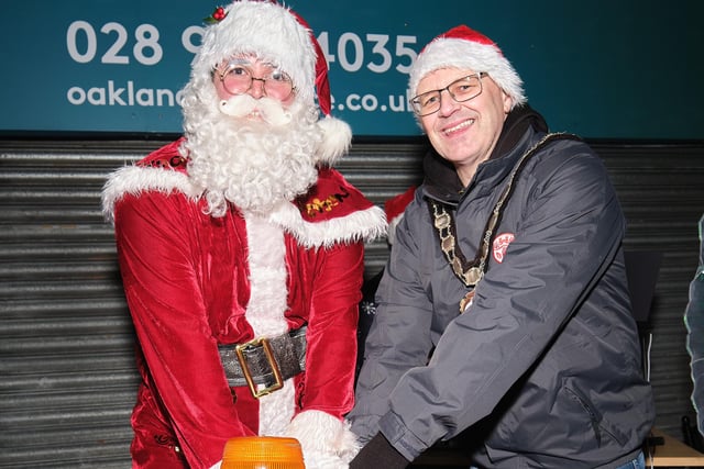 Santa and the Chair of Mid Ulster District Council, Councillor Dominic Molloy, switch on the Maghera Christmas lights.