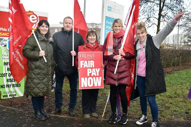 Striking health workers on picket duty at Portadown Health Centre. Included are from left, Kathleen Greaney, Conleth Grimley, Gerardette McVeigh, Louise Geary and Carol Cooper. PT05-209.