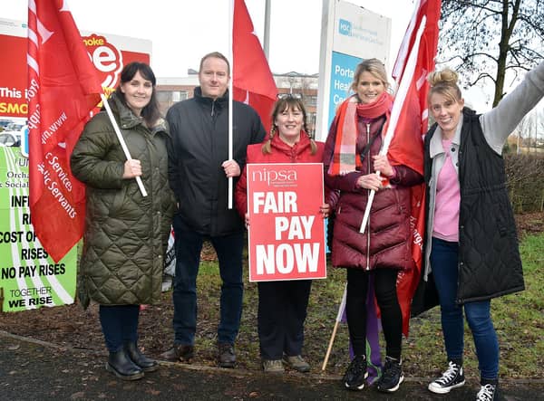 Striking health workers on picket duty at Portadown Health Centre. Included are from left, Kathleen Greaney, Conleth Grimley, Gerardette McVeigh, Louise Geary and Carol Cooper. PT05-209.