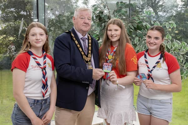 Mayor of Causeway Coast and Glens Borough Council, Councillor Steven Callaghan alongside members of Castlerock Scout Group Amelie Holden and Celia Kerr, Girl Guide Leader Hannah Ruth Mullan, friends and family members as the girls prepare for their attendance at the 25th World Scout Jamboree in South Korea this August. Credit McAuley Multimedia