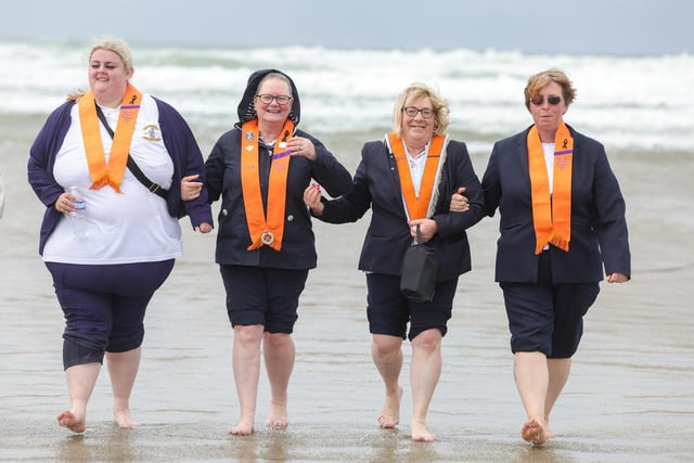 WLOL members on the beach take a paddle in the Atlantic. .