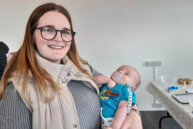 Proud mum Shannon Railton with baby Isaac, dressed for the occasion in his Carrick Connect t-shirt.