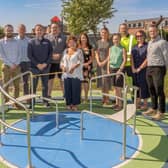 The Mayor, Ald Gerardine Mulvenna, cutting the ribbon at the official opening of the refurbished Woodburn Play Park. Photo by: Chris Neely