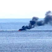 A boat carrying two people burst into flames on Monday (August 14)  after 8pm a number of miles off shore between Ballycastle and Rathlin Island in Co Antrim, it is understood the two onboard jumped into the sea and were rescued by a passing boat. Credit Kevin McAuley/McAuley Multimedia