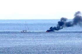 A boat carrying two people burst into flames on Monday (August 14)  after 8pm a number of miles off shore between Ballycastle and Rathlin Island in Co Antrim, it is understood the two onboard jumped into the sea and were rescued by a passing boat. Credit Kevin McAuley/McAuley Multimedia