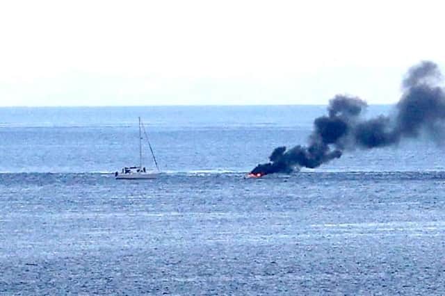 A boat carrying two people burst into flames on Monday (August 14)  after 8pm a number of miles off shore between Ballycastle and Rathlin Island in Co Antrim, it is understood the two onboard jumped into the sea and were rescued by a passing boat. Credit Kevin McAuley/McAuley Multimedia