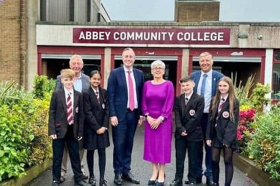 Principal Maria Quinn, pictured welcoming Education Minister Paul Givan to Abbey Community College recently, receives an MBE. Photo: submitted