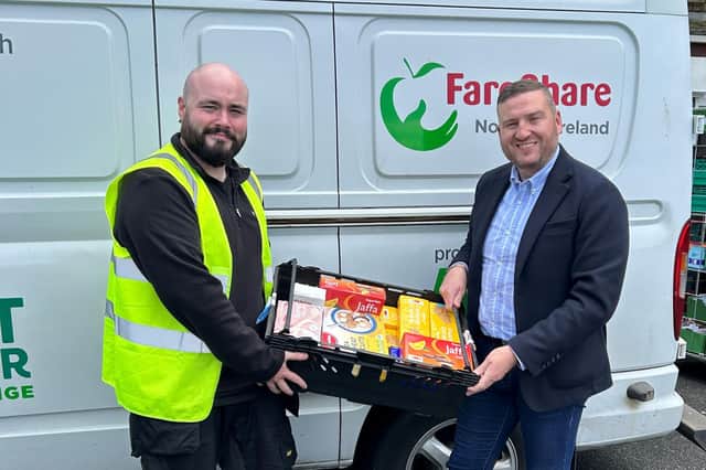 Connor Martin from Fareshare collects food product donations from Musgrave NI’s Director of Marketing, Desi Derby. Credit MCE Comms