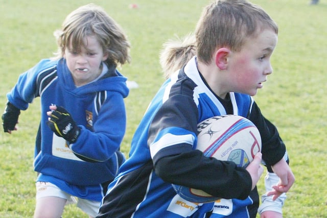 Players give it their all during an enjoyable Mini Rugby Blitz at Coleraine Rugby Club in 2011.