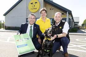 DAERA Minister Andrew Muir is pictured on a visit to Dogs Trust Ballymena where he announced the publication of his Animal Welfare Pathway for companion and farmed animals. Pictured with Minister Muir are Laura Orr, Regional Public Affairs Officer, Adam Clowes Dogs Trust Chief of Staff and Buddy a 6-year-old Labrador cross.