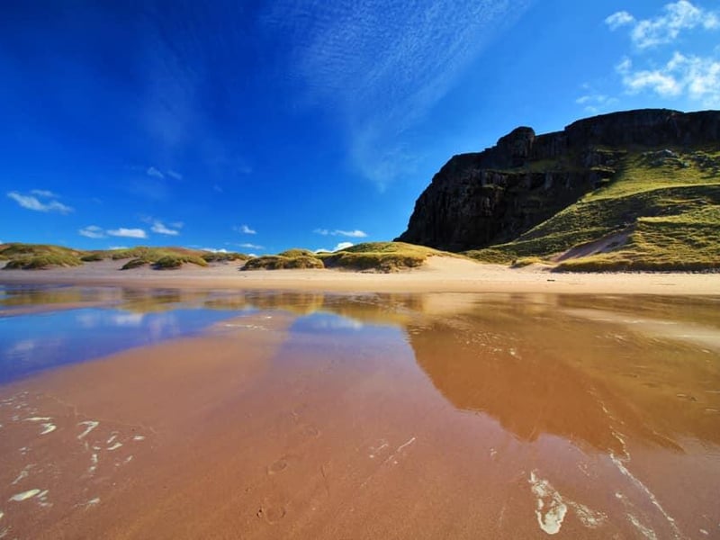 This bay in Sutherland has a reputation as the most beautiful beach in Britain. Described as "wild and spectacular", it is backed by huge sand dunes and a loch.