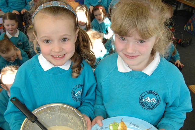 Daisy and Jessica get ready to tuck into one of the pancakes they made with their classmates at Corran Integrated Primary School during Shrove Tuesday 2007.