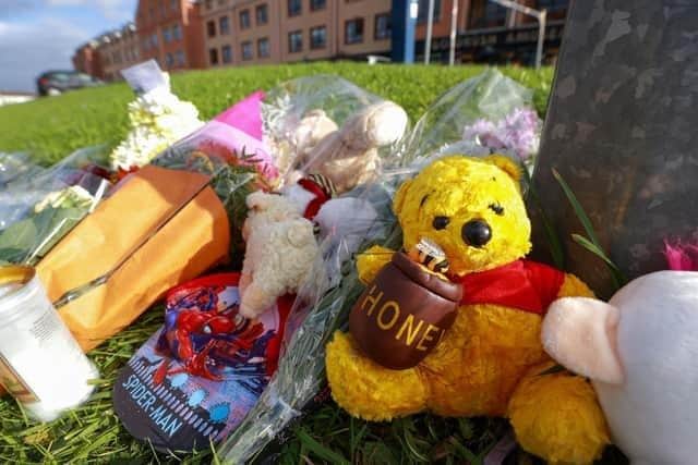 Flowers and soft toys left on Atlantic Way in Bundoran town in tribute to Ronan Wilson from Kildress in Co Tyrone, who was killed in a hit-and-run. The nine-year-old killed had been visiting the Donegal town of Bundoran when he was struck by a vehicle on Saturday evening. Credit: PA