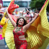 This colourful participant enjoying taking part in Saturday's Mela Carnival parade.