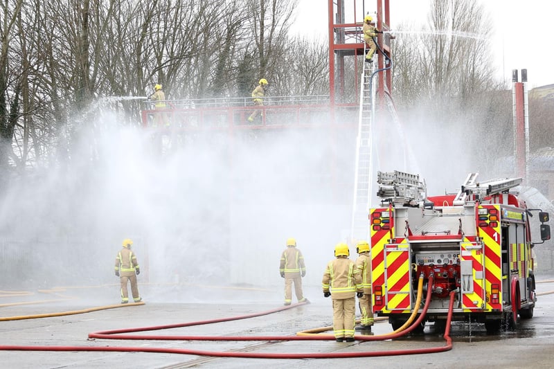 Firefighters demonstrating their skills.