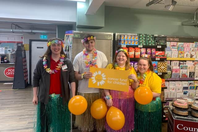 Stephen Nelson, Dale Campbell, Rachel McMullan and Charlotte Stewart from EUROSPAR Lagan Valley, fundraising to mark Childhood Cancer Awareness Month