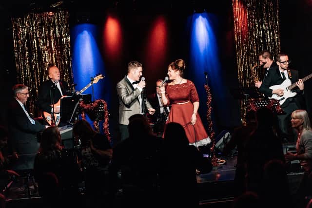 Singer Michelle Baird who will be taking a walk down memory lane as she appears on stage at the Riverside Theatre in Coleraine twice next month - the stage where she began her career. She is pictured here singing with her husband Matt and their band Sodapopz. Credit Michelle Baird