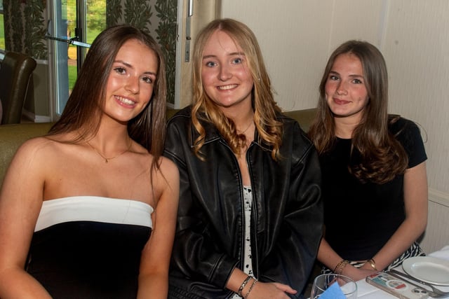 Posing happily at the hockey dinner are from left, Makyla Stevenson, Evie Mahood and Martha Speers. PT18-302.