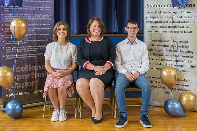 Highest overall achievement at 'A’ Level – Neil McKay (4 A* Grades) also included is Emily Davidson (3 A* and 1 A) and Principal Miss Evans.